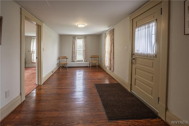 4724 Wilson Burt Rd, Wilson, NY 14172 - entrance foyer featuring radiator heating unit and dark wood-type flooring