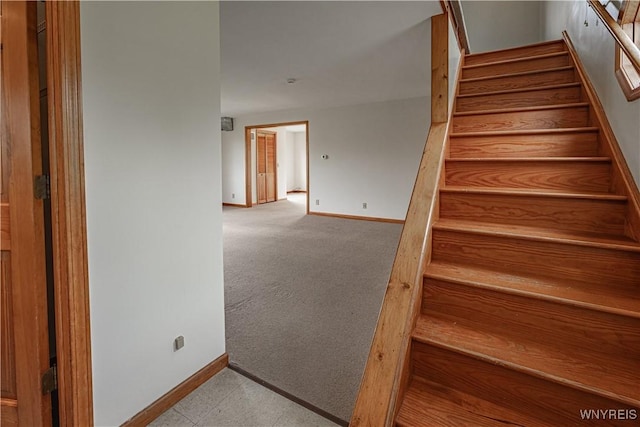 4724 Wilson Burt Rd, Wilson, NY 14172 - stairway with baseboards and carpet floors