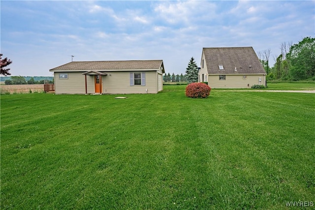 4724 Wilson Burt Rd, Wilson, NY 14172 - back of house featuring a lawn