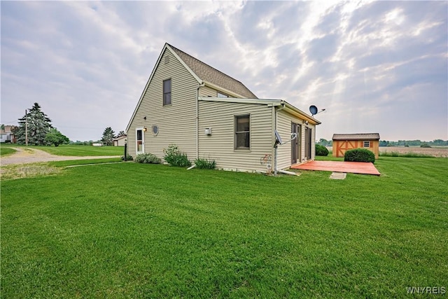 4724 Wilson Burt Rd, Wilson, NY 14172 - view of side of property with a lawn, a deck, and a storage shed