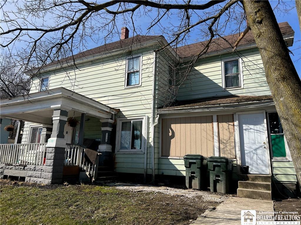339 Falconer St, Jamestown, NY 14701 - view of front of house featuring entry steps, a porch, and a chimney