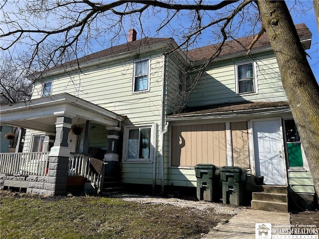 339 Falconer St, Jamestown, NY 14701 - view of front of house featuring entry steps, a porch, and a chimney