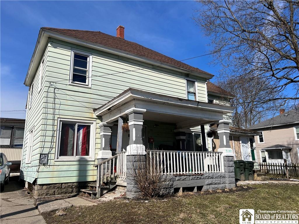 339 Falconer St, Jamestown, NY 14701 - traditional style home featuring covered porch and a chimney