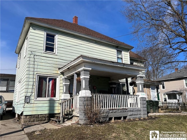 339 Falconer St, Jamestown, NY 14701 - traditional style home featuring covered porch and a chimney