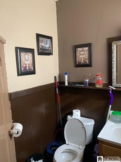 400 Buffalo St, Jamestown, NY 14701 - half bathroom featuring toilet and vanity