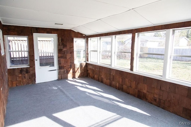 4114 Wetzel Rd, Clay, NY 13090 - unfurnished sunroom with wooden walls, carpet, and vaulted ceiling