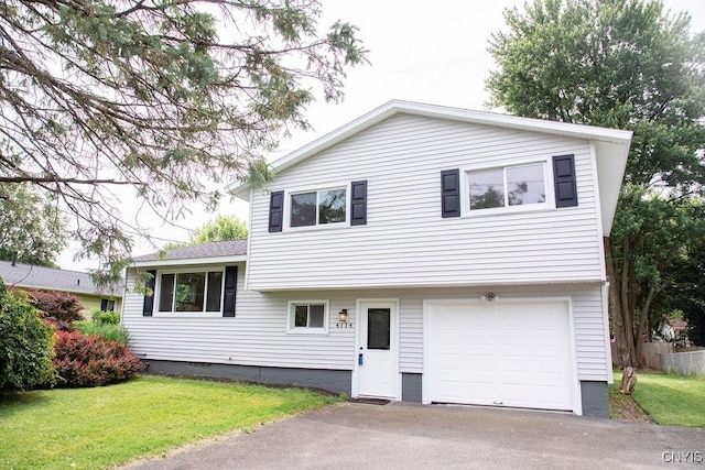 4114 Wetzel Rd, Clay, NY 13090 - split level home with a garage, a front lawn, and asphalt driveway