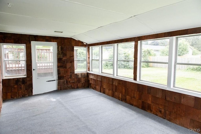 4114 Wetzel Rd, Clay, NY 13090 - unfurnished sunroom featuring wooden walls, carpet flooring, and vaulted ceiling