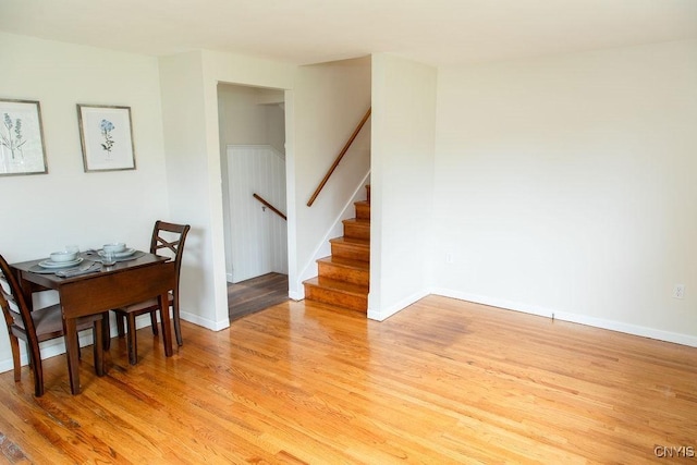 4114 Wetzel Rd, Clay, NY 13090 - dining area featuring light wood finished floors and stairs