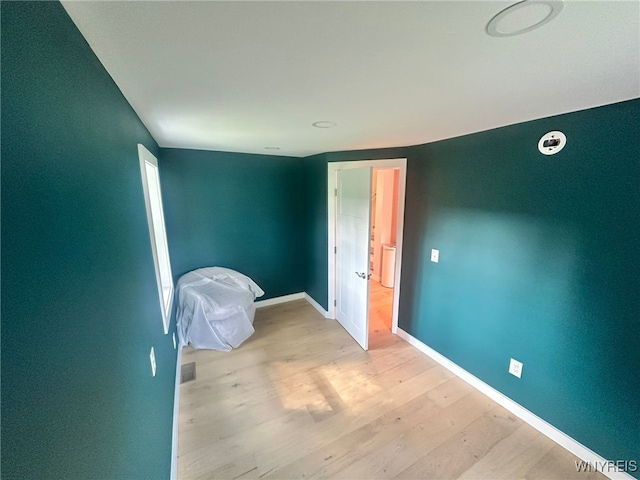 876 Hittown Rd, Caton, NY 14871 - unfurnished bedroom with wood finished floors and baseboards
