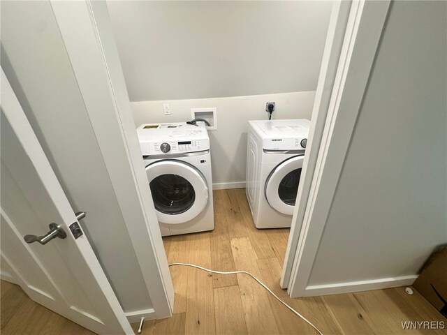 876 Hittown Rd, Caton, NY 14871 - laundry room with washing machine and clothes dryer and light wood-type flooring