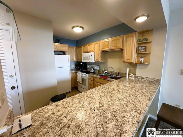 23 Seneca Dr, Chautauqua, NY 14728 - kitchen featuring white appliances, light brown cabinetry, a peninsula, wood finished floors, and light stone counters