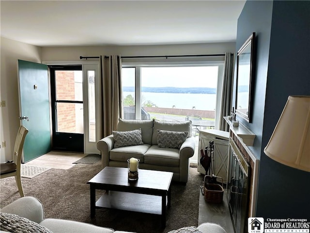 23 Seneca Dr, Chautauqua, NY 14728 - living room with carpet flooring and a water view