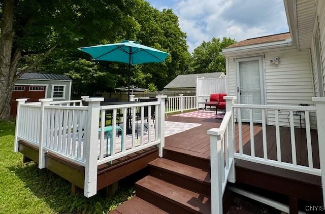 4079 Onondaga Blvd, Onondaga, NY 13031 - wooden terrace with an outbuilding and view of scattered trees