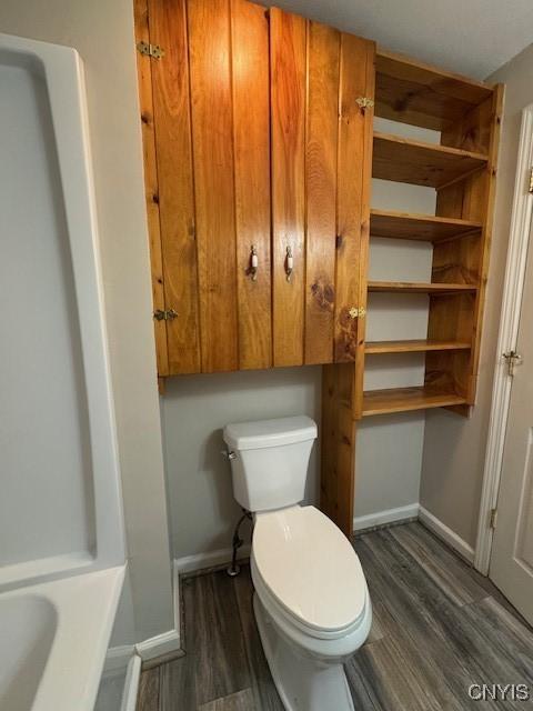 4079 Onondaga Blvd, Onondaga, NY 13031 - full bath with toilet and wood finished floors