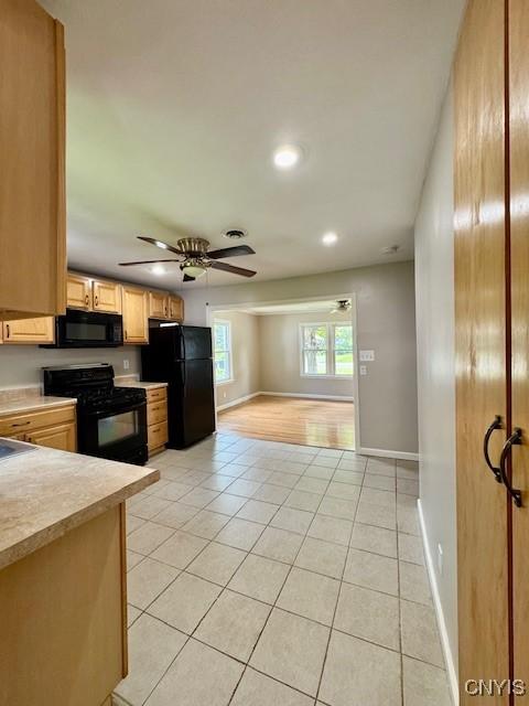 4079 Onondaga Blvd, Onondaga, NY 13031 - kitchen featuring black appliances, light tile patterned floors, light countertops, ceiling fan, and recessed lighting