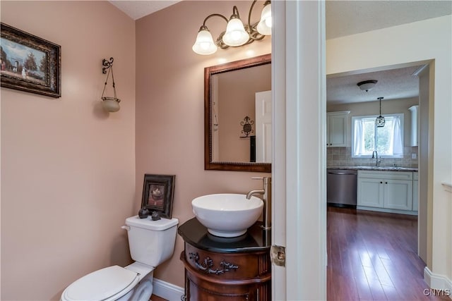 40 Phyllis Ln, Hastings, NY 13076 - bathroom with backsplash, vanity, and wood finished floors