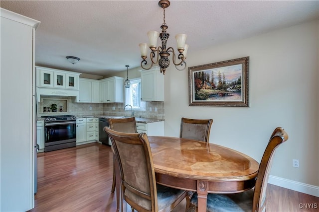 40 Phyllis Ln, Hastings, NY 13076 - dining area with wood finished floors and a chandelier