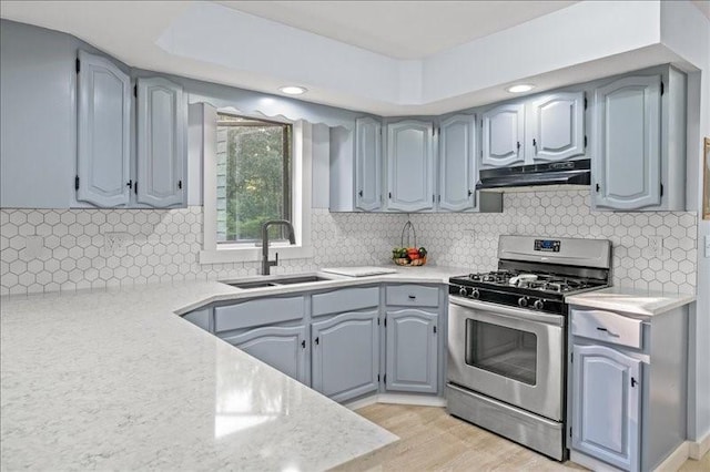 1135 Ridge Rd, Hamden, NY 13782 - kitchen with stainless steel range with gas cooktop, under cabinet range hood, light countertops, tasteful backsplash, and recessed lighting
