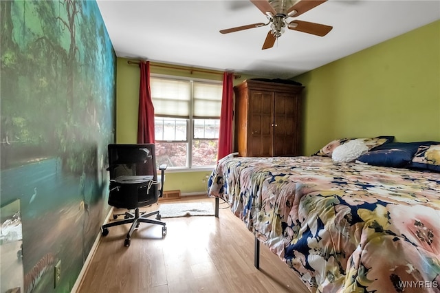 330 Hunters Ln, Amherst, NY 14221 - bedroom featuring wood finished floors, ceiling fan, and an office area