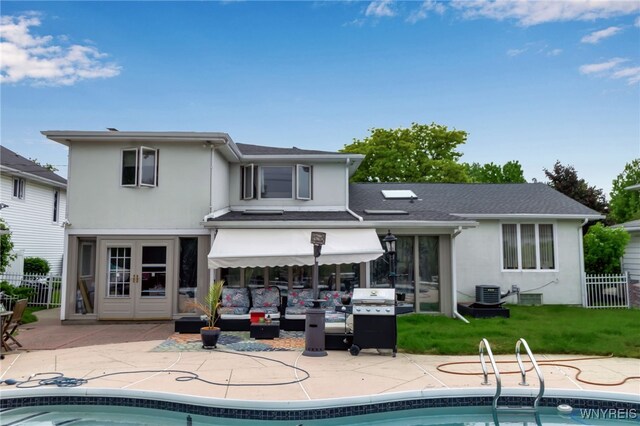 330 Hunters Ln, Amherst, NY 14221 - rear view of property with stucco siding, an outdoor pool, a patio area, and french doors