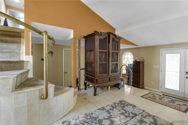 330 Hunters Ln, Amherst, NY 14221 - tiled foyer featuring stairs and baseboards