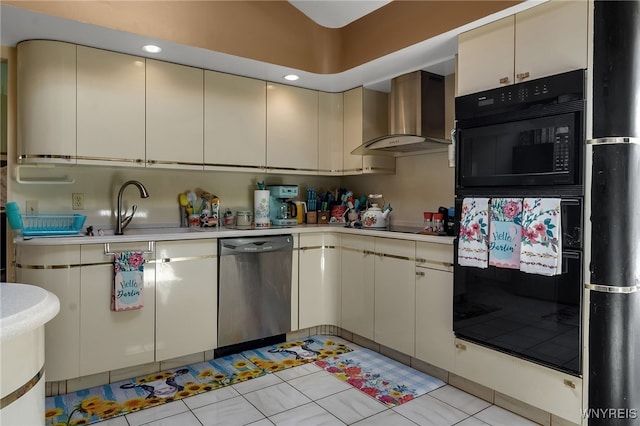 330 Hunters Ln, Amherst, NY 14221 - kitchen featuring black appliances, wall chimney exhaust hood, light countertops, cream cabinets, and recessed lighting