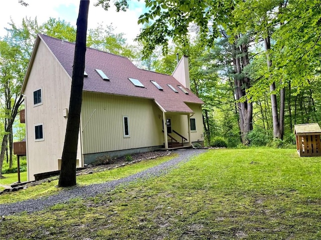 735 Howell Rd, Conquest, NY 13140 - back of house featuring a lawn and a shingled roof