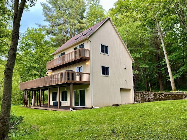 735 Howell Rd, Conquest, NY 13140 - rear view of property with a balcony, a lawn, and a wooden deck