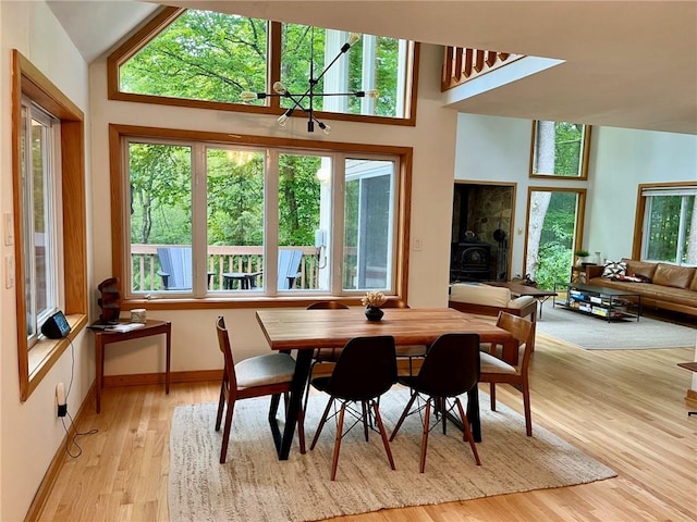 735 Howell Rd, Conquest, NY 13140 - dining space featuring a chandelier and light wood finished floors