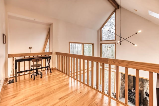 735 Howell Rd, Conquest, NY 13140 - hallway with high vaulted ceiling, wood finished floors, and beam ceiling
