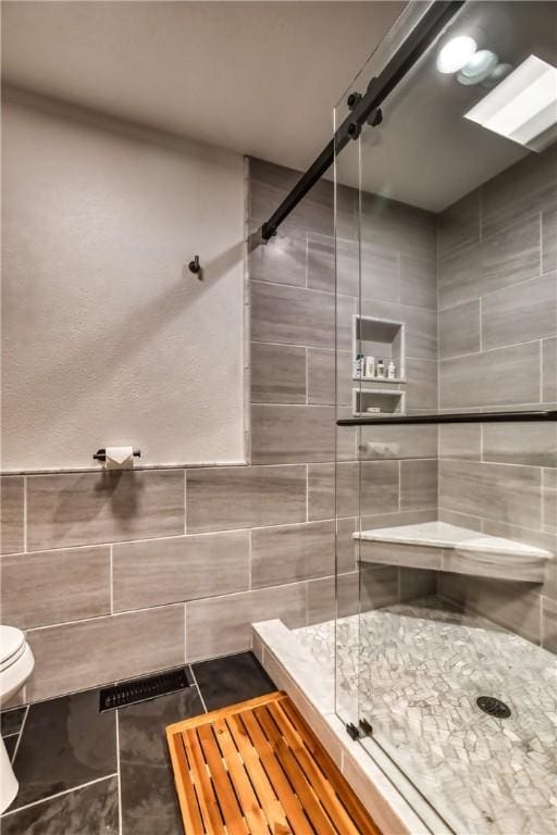 735 Howell Rd, Conquest, NY 13140 - full bathroom with tile walls and a stall shower