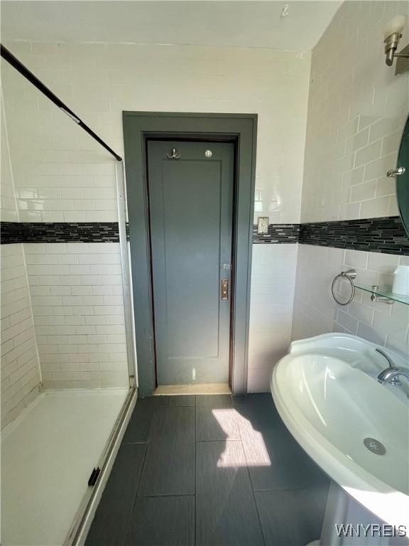 2010 Niagara St, Niagara Falls, NY 14303 - full bath with a stall shower and tile walls