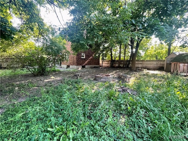 2010 Niagara St, Niagara Falls, NY 14303 - view of yard featuring a fire pit and a storage shed