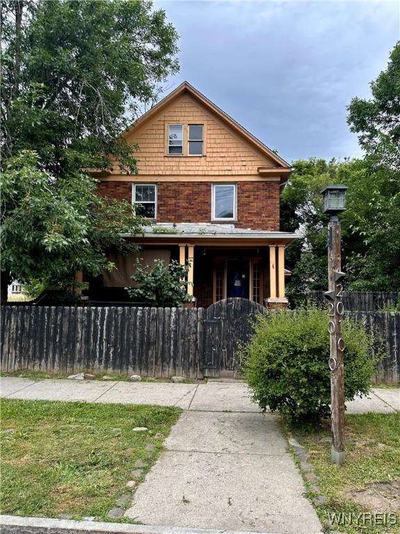 2010 Niagara St, Niagara Falls, NY 14303 - view of front of house with a fenced front yard and a gate
