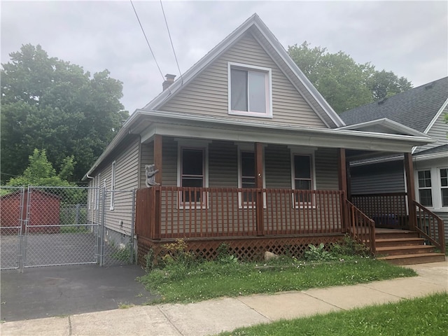 460 Campbell St, Rochester, NY 14611 - view of front of house featuring covered porch, a gate, and a chimney