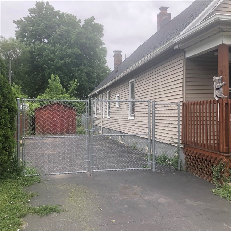 460 Campbell St, Rochester, NY 14611 - view of side of property featuring a gate and a chimney