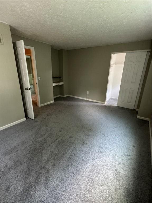 94 Brookhaven, Rochester, NY 14621 - unfurnished living room with a textured ceiling and carpet flooring
