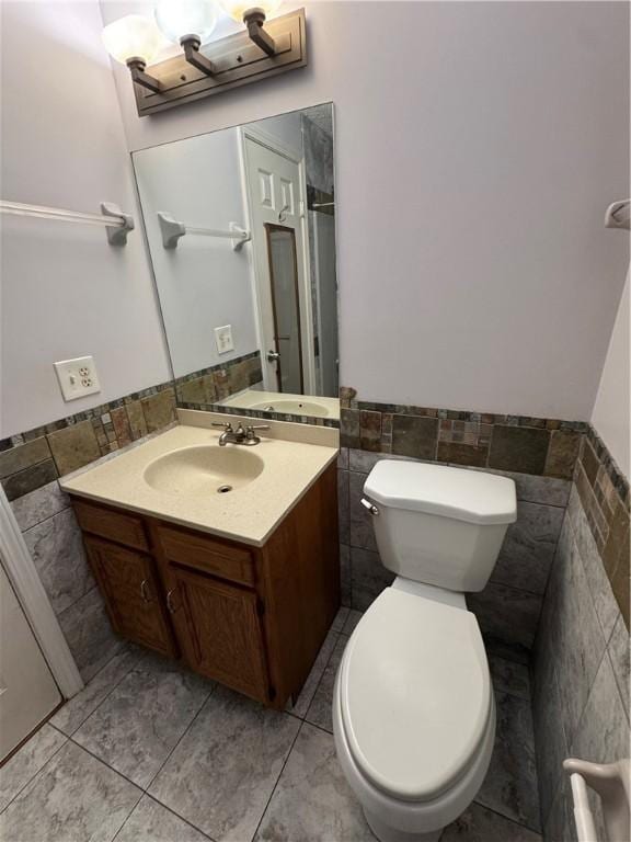 94 Brookhaven, Rochester, NY 14621 - bathroom featuring tile walls, vanity, and wainscoting