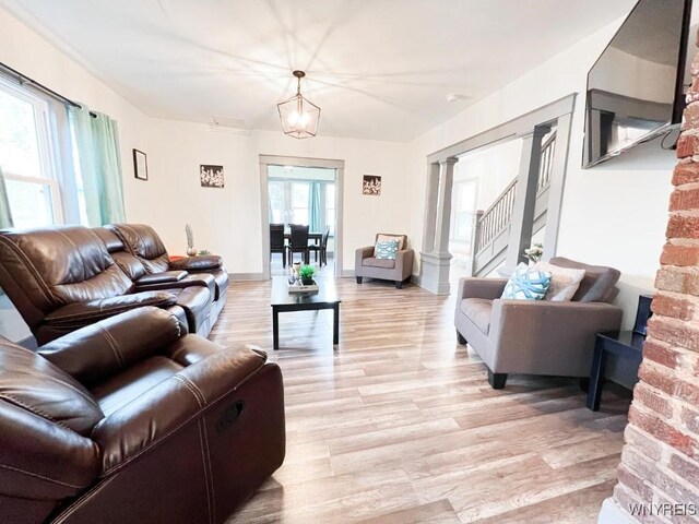 2218 Ferry Ave, Niagara Falls, NY 14301 - living area with light wood-type flooring and decorative columns