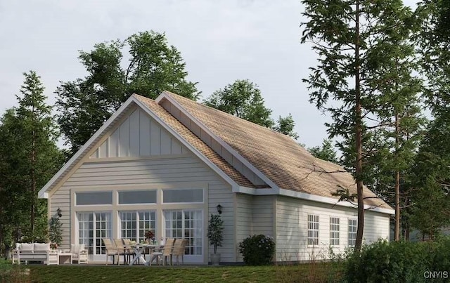 9395 Lakeshore View Rd, Sullivan, NY 13037 - rear view of house featuring board and batten siding and an outdoor living space