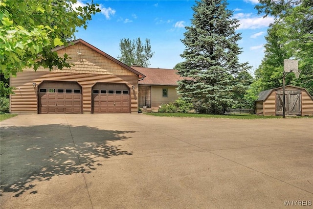2328 Gowanda Zoar Rd, Collins, NY 14070 - view of front of house featuring a shed, concrete driveway, and an attached garage
