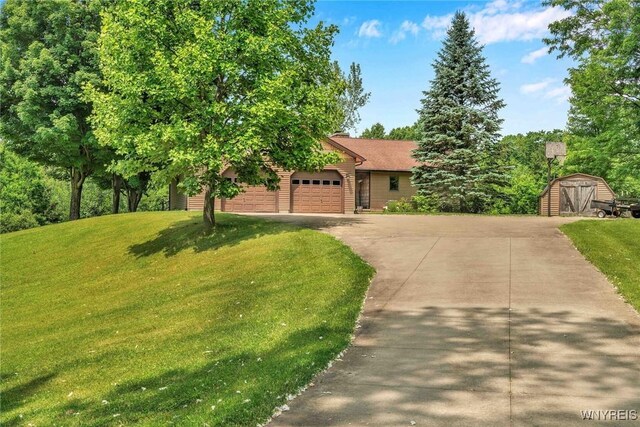 2328 Gowanda Zoar Rd, Collins, NY 14070 - view of property hidden behind natural elements featuring driveway, a front lawn, an attached garage, and a shed