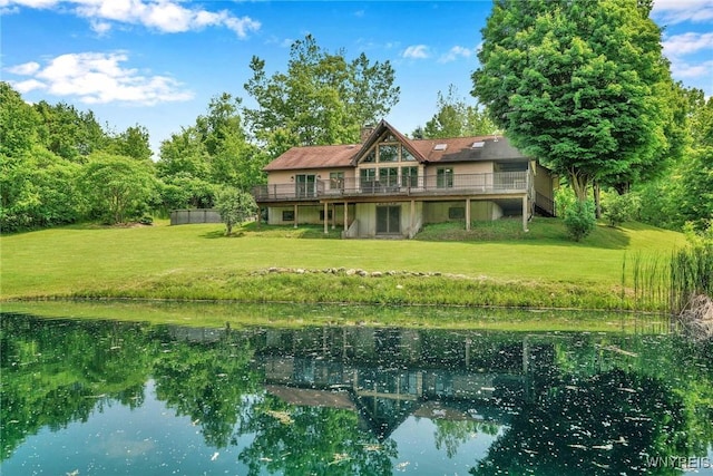 2328 Gowanda Zoar Rd, Collins, NY 14070 - back of property featuring a lawn, a chimney, and a deck with water view