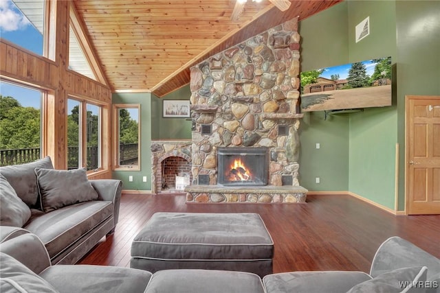 2328 Gowanda Zoar Rd, Collins, NY 14070 - living area featuring wooden ceiling, a stone fireplace, hardwood / wood-style floors, high vaulted ceiling, and a ceiling fan