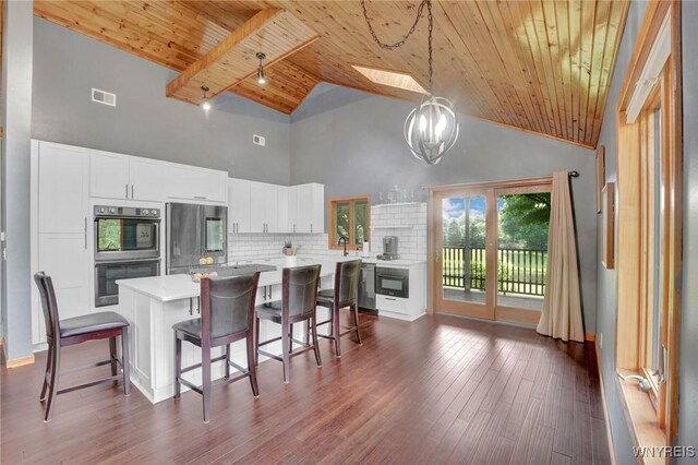 2328 Gowanda Zoar Rd, Collins, NY 14070 - kitchen with stainless steel appliances, wood ceiling, high vaulted ceiling, light countertops, and a skylight