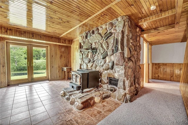 2328 Gowanda Zoar Rd, Collins, NY 14070 - unfurnished living room featuring wooden walls, wood ceiling, french doors, and a wood stove