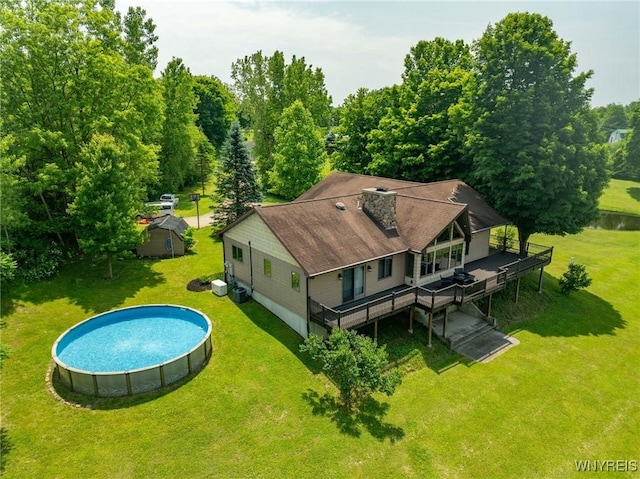 2328 Gowanda Zoar Rd, Collins, NY 14070 - back of house featuring a deck, an outdoor pool, a yard, and a chimney
