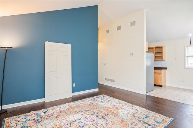 39 Castleford Rd, Greece, NY 14616 - unfurnished room featuring high vaulted ceiling and light wood-style floors