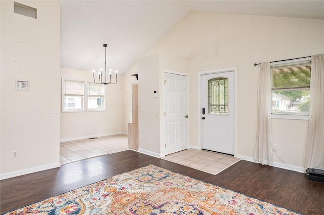 39 Castleford Rd, Greece, NY 14616 - entryway featuring a chandelier, wood finished floors, healthy amount of natural light, and lofted ceiling